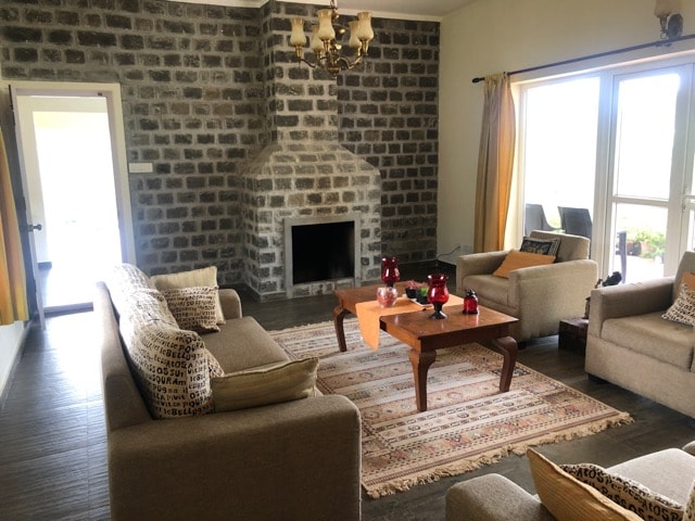 Vantage Home living room with stone accent wall